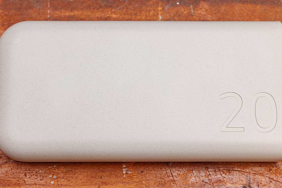 Slim white power bank on a light surface (representative photo, not the exact product)