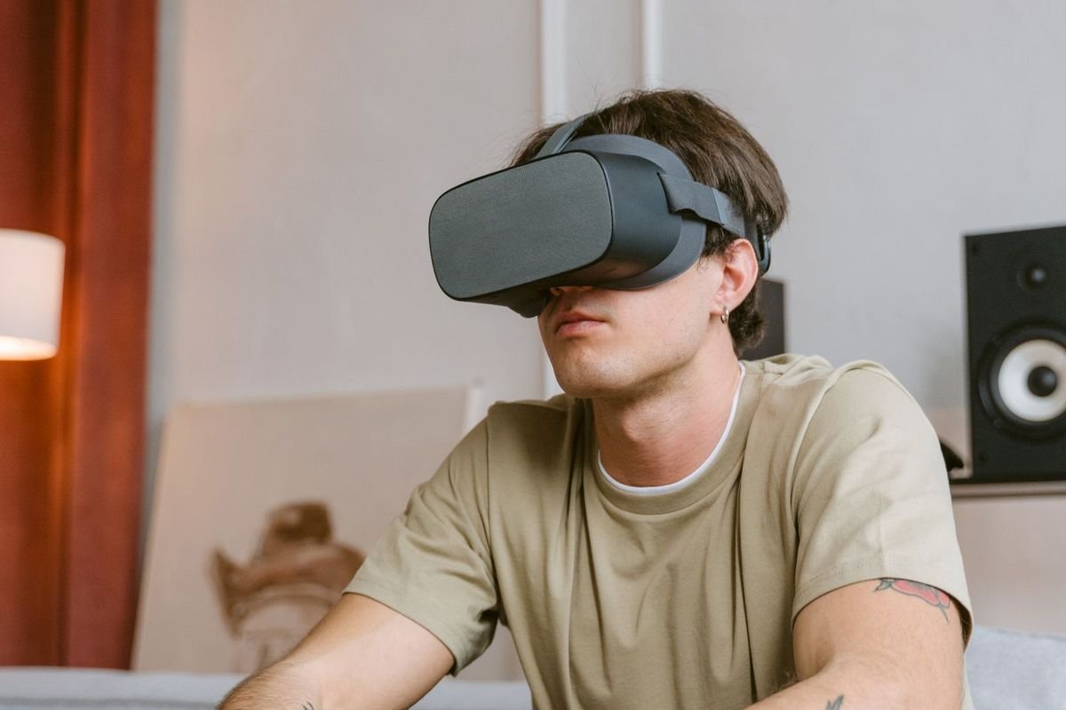 Young man wearing a VR headset (representative photo, not the exact product)
