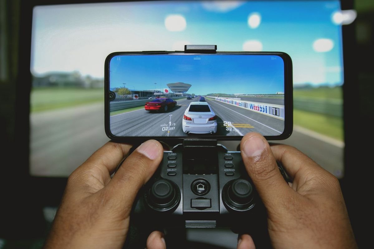 Close-up of hands playing a game on a phone (representative photo, not the exact product)