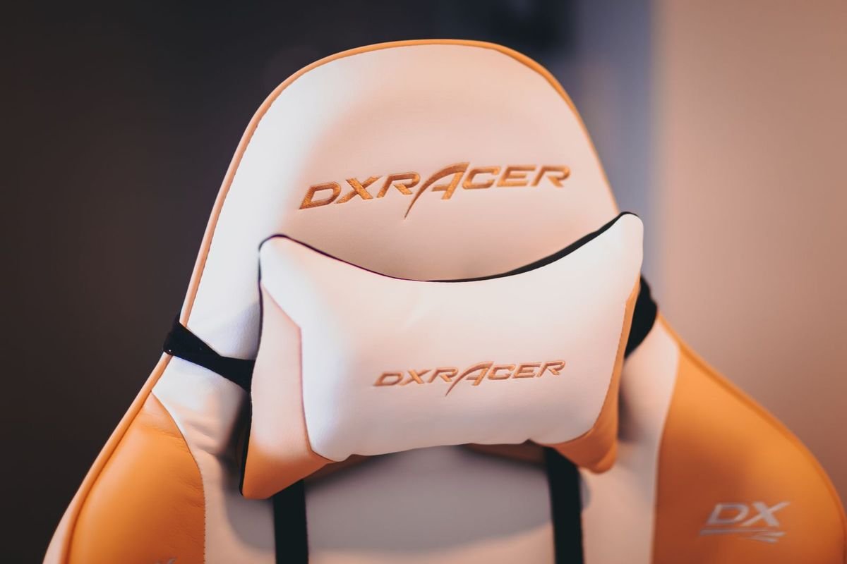 White and brown gaming chair with a head cushion (representative photo, not the exact product)
