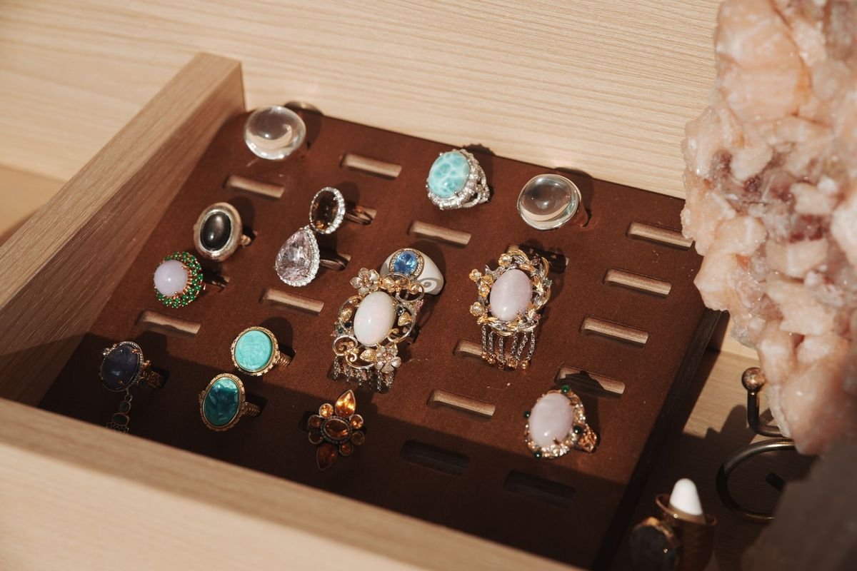 Jewelry box with gemstone rings (representative photo, not the exact product)