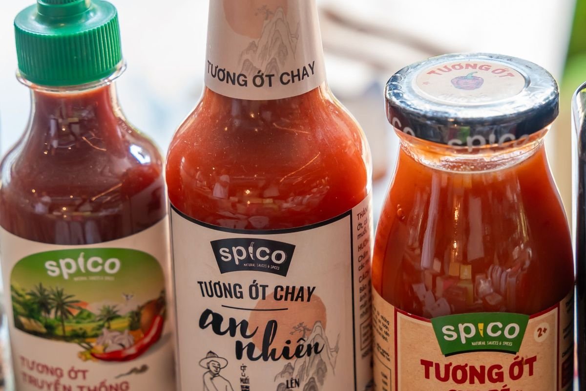 Various spicy condiment bottles on a table (representative photo, not the exact product)