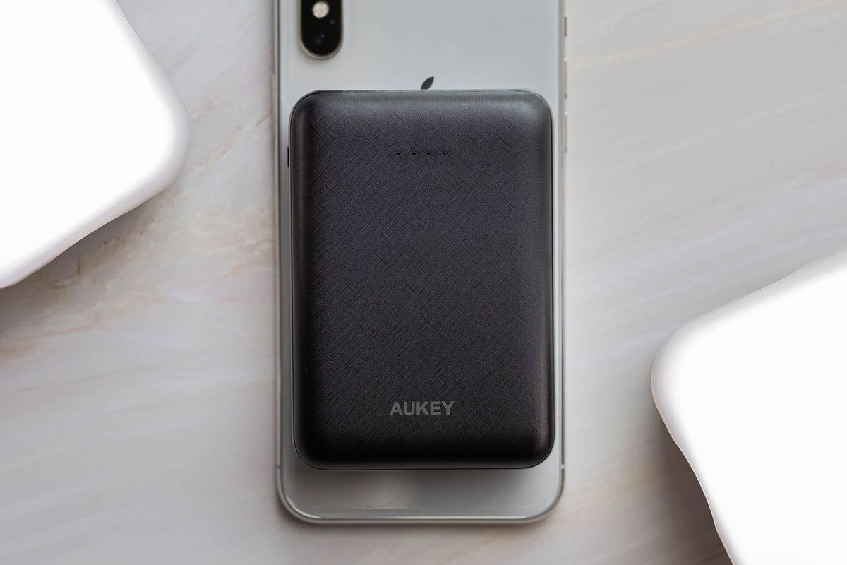 Compact power bank on the back of a smartphone (representative photo, not the exact product)