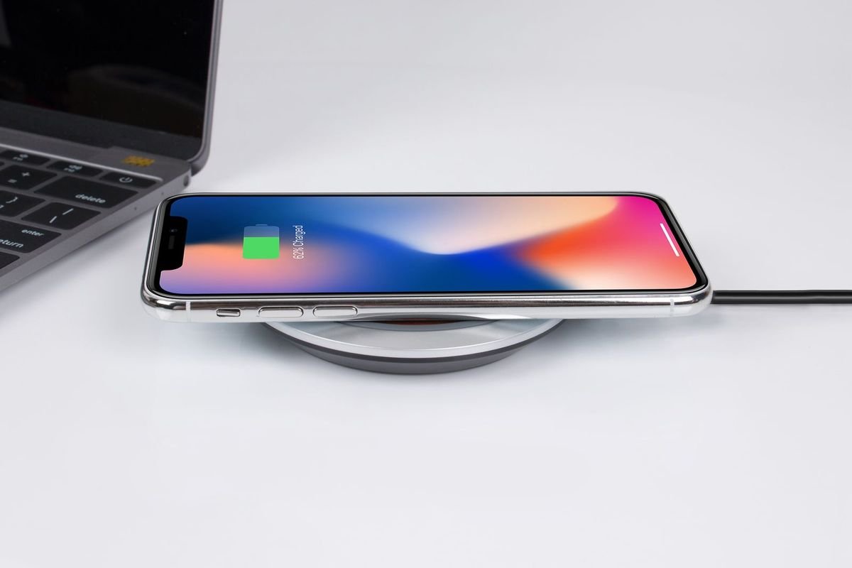 Smartphone charging on a wireless charger (representative photo, not the exact product)