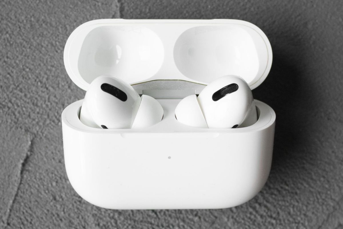 White wireless earbuds in an open case (representative photo, not the exact product)