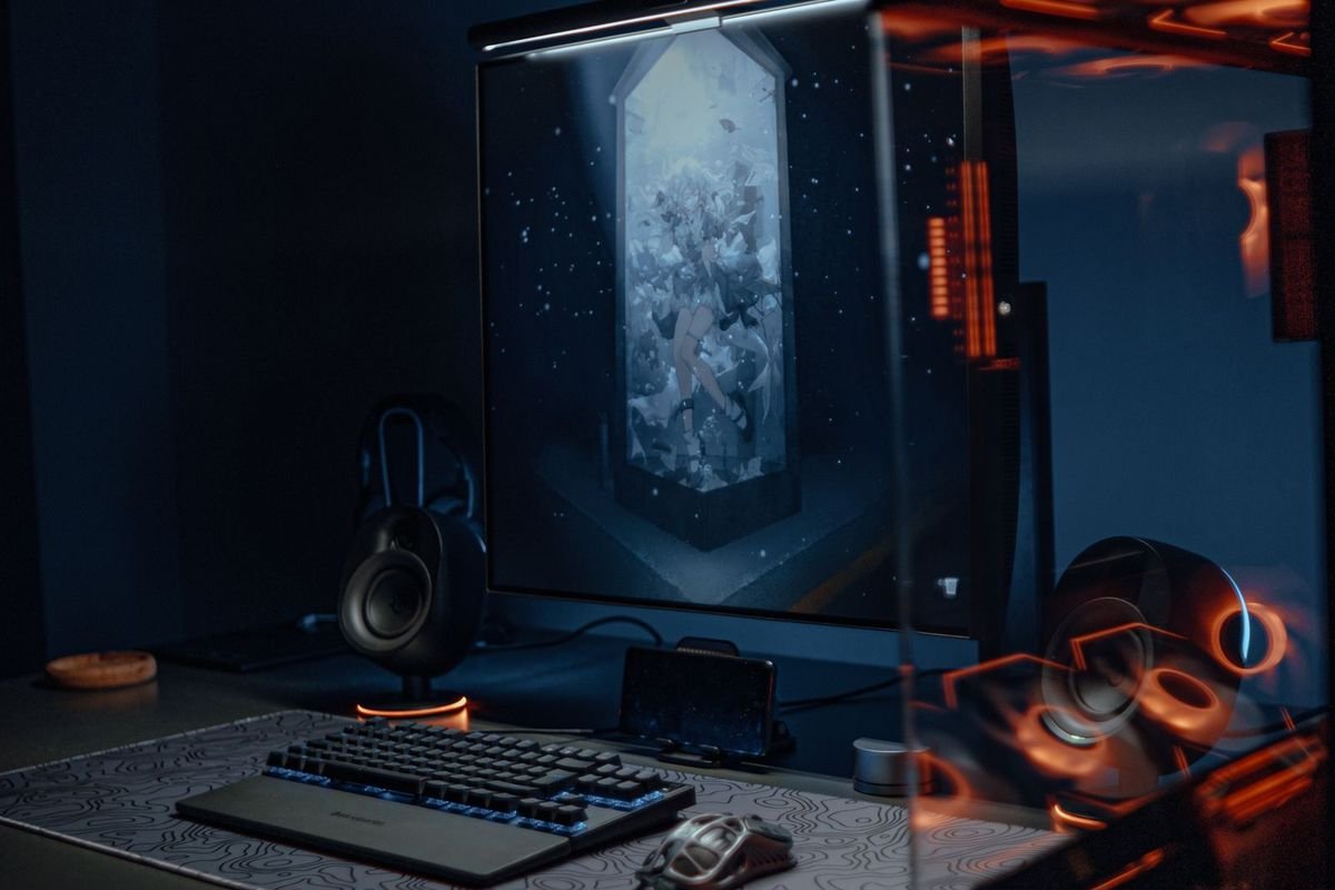 Gaming setup with RGB lights in a dark room (representative photo, not the exact product)