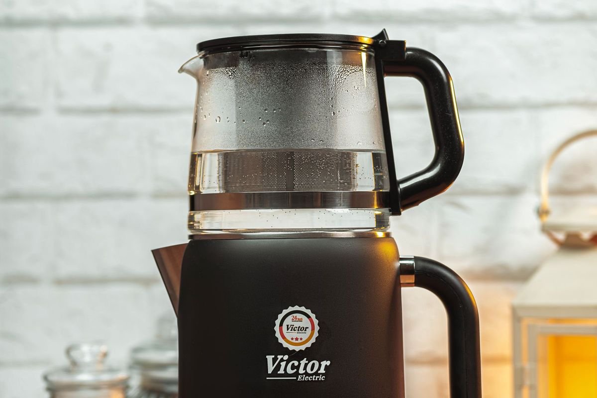 Black electric kettle on a wooden kitchen counter (representative photo, not the exact product)