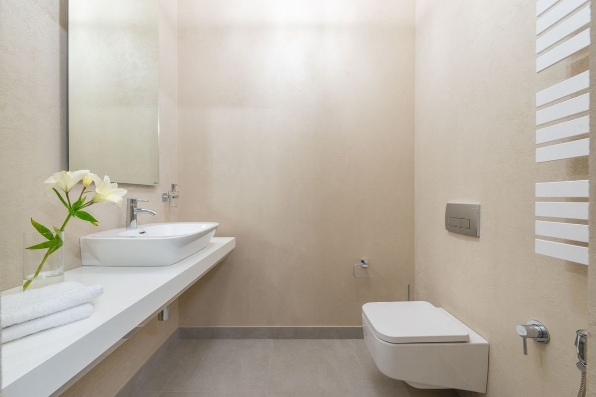 Modern bathroom with toilet and sink (representative photo, not the exact product)