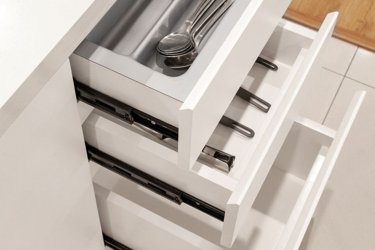 Utensil organizer inside a kitchen drawer (representative photo, not the exact product)